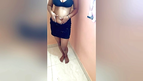 Indian chick in a bikini moves around in the house