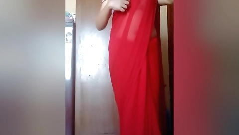 Indian girl with a red saree masturbating on webcam