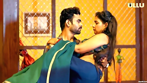 Brunette milf in a black dress and stockings shows her big tits