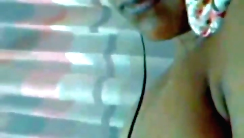 Stunning brunette in stockings shows off her booty in solo