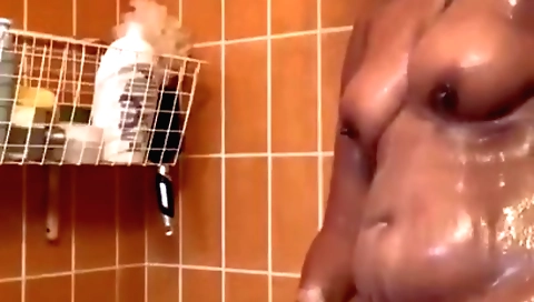 Brunette indian in sexy outfit is having fun with herself in shower