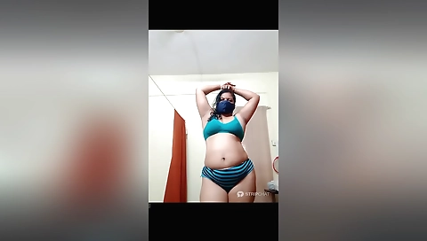 Amateur brunette with natural boobs is showing herself