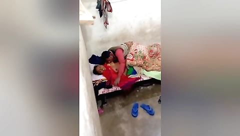 Indian stepmom with a pink toy is having fun in the kitchen