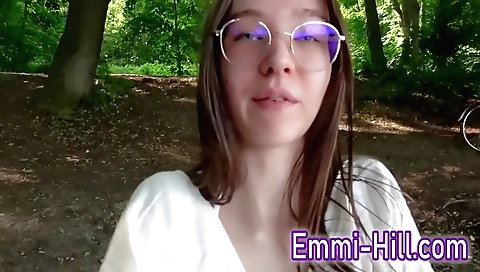 A horny amateur girl in a black t-shirt gets naked outdoors