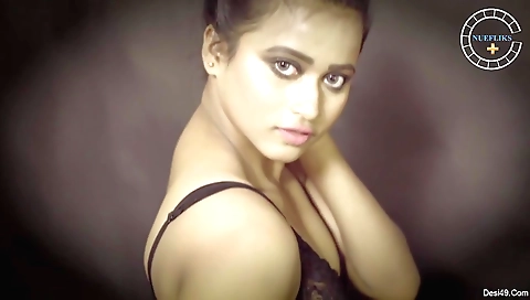 Sexy brunette girl in a sexy dress and stockings in the room